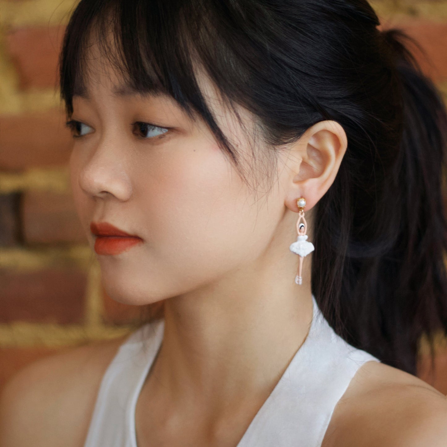 A beautiful girl wears the ballet girl earrings